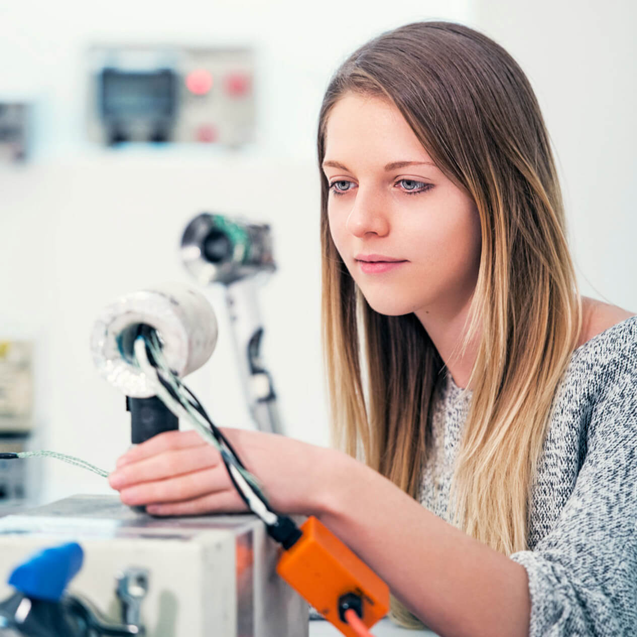 A female Dyson engineer working on a Dyson supersonic test rig.