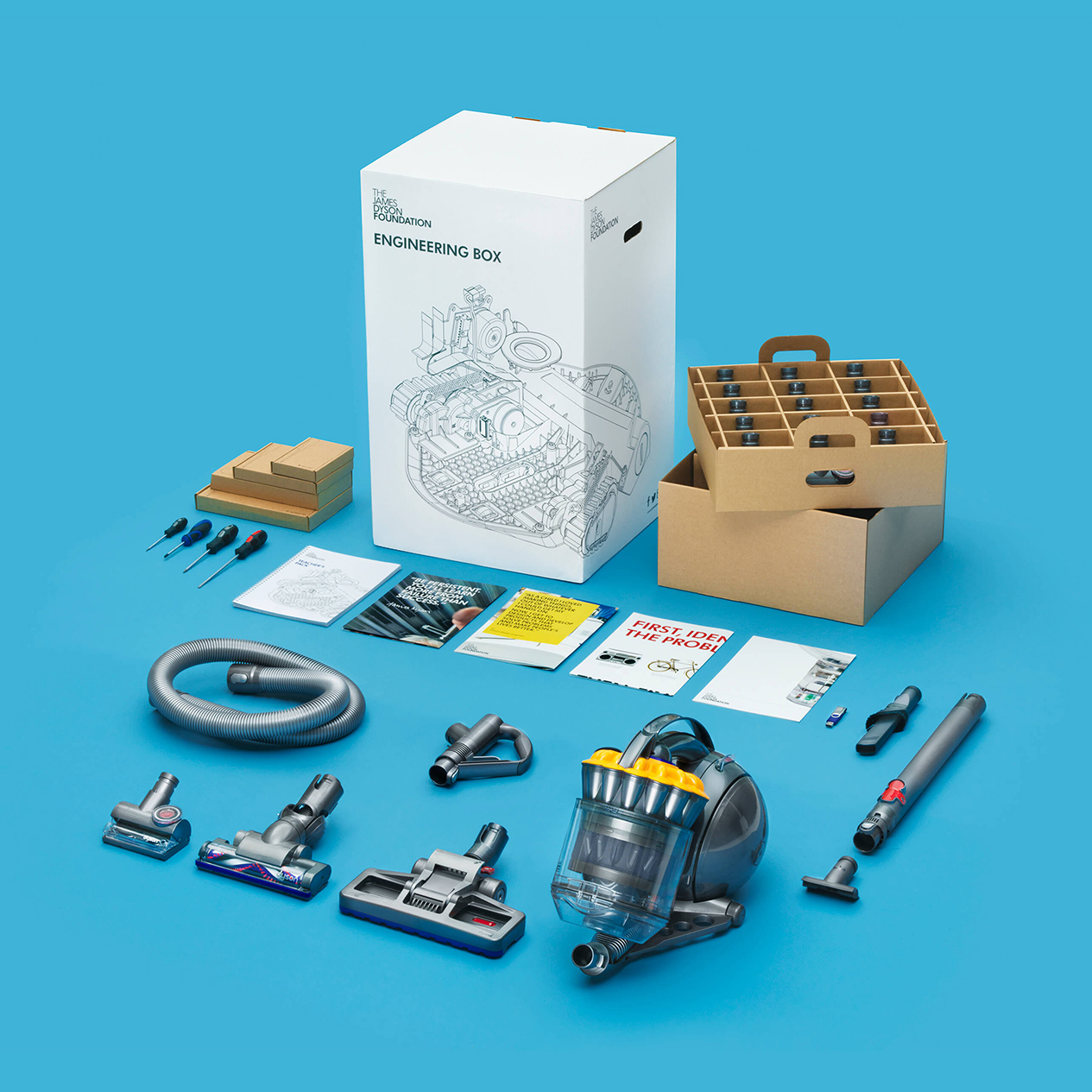 An image displaying the contents of the Engineering Box, such as posters and Dyson technology parts.