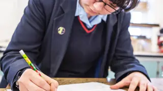 A student sketching ideas for an invention.