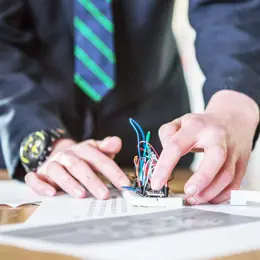 A student working on a circuit square.