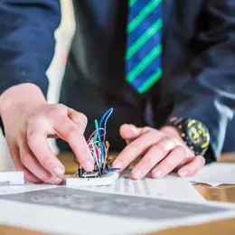 A student working on a circuit square.