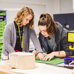 Two students assembling a prototype.