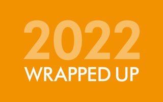 '2022 wrapped up' written in white on an orange background.